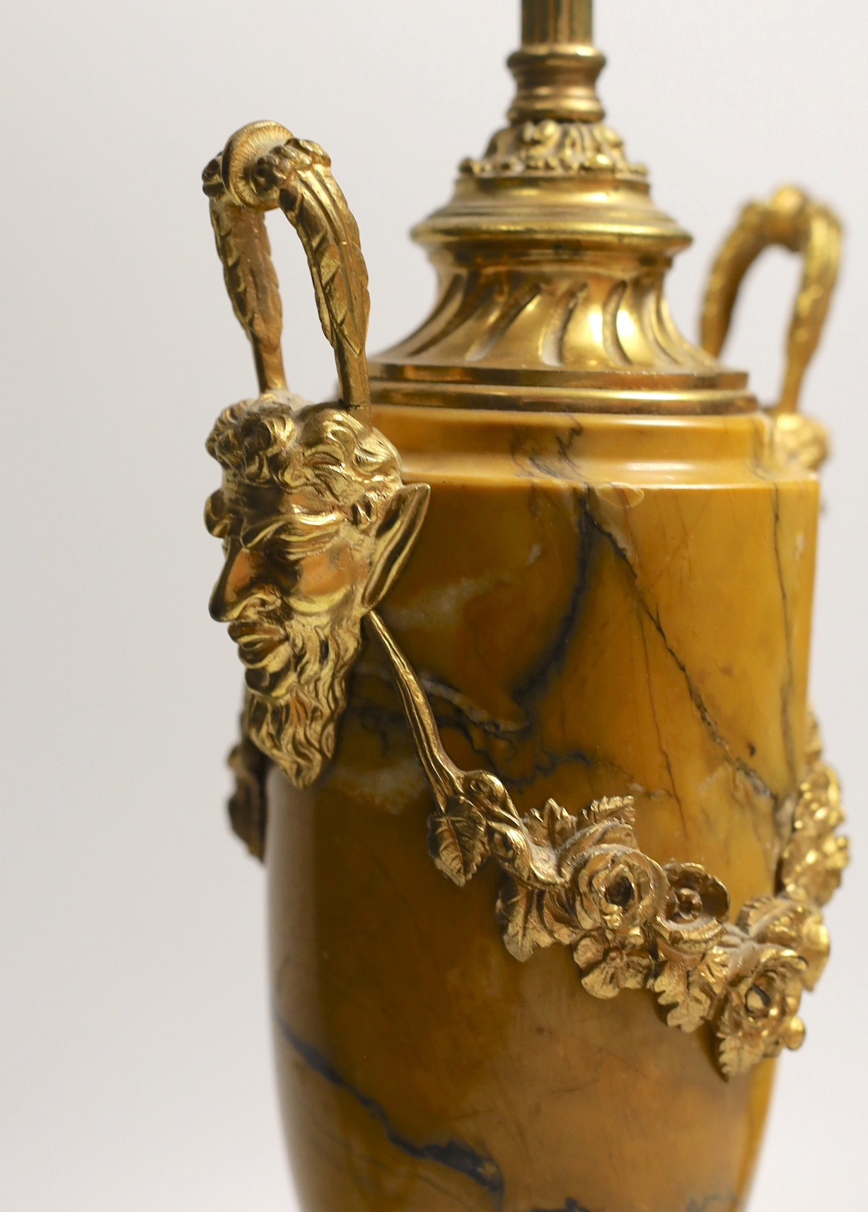 A pair of neo classical revival gilt metal and Siena marble lamps, 43cms high including light fitting